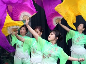 Members of the Sunshine Dance group perform a fan dance during the Filipino Festival in 2012. The festival will be allowed to keep its parade route down McPhillips Street this year. (BRIAN DONOGH/WINNIPEG SUN FILE PHOTO)