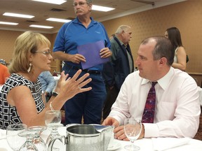 Marlene Wood, general manager of Tourism Sarnia-Lambton, speaks with Kelly Hill on Tuesday June 23, 2015 in Point Edward, Ont., at the annual general meeting of the Sarnia-Lambton Economic Partnership. Hill, a consultant based in Hamilton, is preparing a creative communities study for the partnership. (Paul Morden/Sarnia Observer/Postmedia Network)