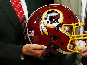The Washington Redskins logo is seen on the team`s helmet during a press conference earlier this year. (Geoff Burke/USA TODAY Sports)
