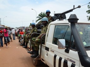 UN Peacekeeping troops patrol the main market at "Kilometre Five" in Bangui on May 18, 2015. AFP Photo/ Patrick Fort