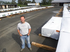 ERNST KUGLIN/THE INTELLIGENCER
The Castle Building Centre banner will soon fly from the new store on Highway 2, just west of Wallbridge-Loyalist Road. The former Home Hardware store was purchased by Peterborough based Alf Curtis Home Improvements in April and will operate as a member of Castle Building Centres Group Ltd. Store manager Preston Collins has been working to transform the building in a new store and stocking the lot with merchandise in preparation for a mid August opening.