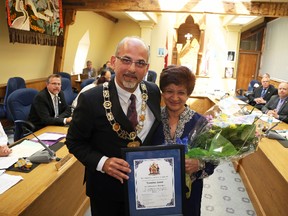 Jason Miller/The Intelligencer
Mayor Taso Christopher awards longtime city hall employee Yasmina Jamal with a commemorative plaque marking her retirement after 35 years, primarily in the treasury department. Yasmina attended council with her family including two grown sons and spoke about moving to Canada more than 40 years ago as a Ugandan refugee.