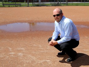 Jon Swaine, a minor baseball and softball coach, at Cloverdale Park on Tuesday. (Ian MacAlpine /The Whig-Standard)