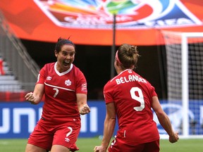 Canada’s Josée Bélanger celebrates her goal against Switzerland with teammate Rhian Wilkinson (left) during the second half of FIFA Women's World Cup soccer action in Vancouver on June 21, 2015. (Carmine Marinelli/Postmedia Network)