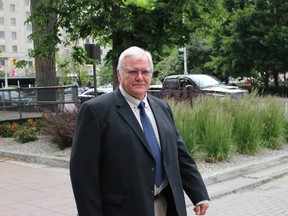 Former government scientist Dr. Klaus Nielsen leaves the courthouse on Tuesday, June 23, 2015 after his sentencing hearing concluded for the day. Nielsen pleaded guilty in August to breach of trust and violating federal statutes governing the transportation of dangerous substances after he was arrested with live bacteria in October 2012 on the way to the airport and China. (TONY SPEARS/Ottawa Sun/Postmedia Network)