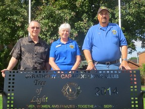 From left to right: Dave Brock, BIA chair, Mariette Desjardine, Lions Club president, and Ed Hadbavny, incoming president, during the presentation of the first of 18 benches placed in Strathroy’s downtown.