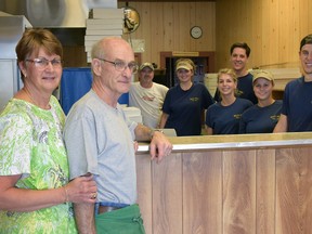 Irene and Don Baxter, shown here with their staff at Bill's Pizza (and son Kevin), are looking forward to retirment. The Tillsonburg family has owned and operated Bill's Pizza for the past 43 years. Saturday was their final night. CHRIS ABBOTT/TILLSONBURG NEWS