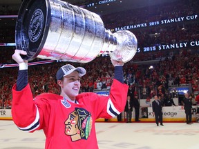 Chicago Blackhawks left wing Teuvo Teravainen (86) hoists the Stanley Cup after defeating the Tampa Bay Lightning in game six of the 2015 Stanley Cup Final at United Center. (Dennis Wierzbicki-USA TODAY Sports)