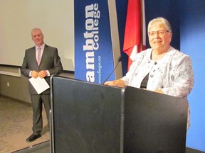 Jim Burns, chairperson of the Lambton College board of governors, looks on as Sarnia-Lambton MP Pat Davidson speaks during an announcement on Wednesday June 24, 2015 in Sarnia, Ont., that the federal and provincial governments will each contribute $10 million to help build a $30-million Centre for Health Education Sustainable Care at the college. Paul Morden/Sarnia Observer/Postmedia Network
