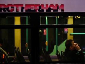 People travel on a bus in Rotherham, northern England, February 4, 2015. (DARREN STAPLES/Reuters)
