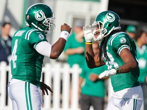 Saskatchewan Roughriders wide receiver Taj Smith (R) and teammate quarterback Darian Durant celebrate Smith's touchdown while playing against the Winnipeg Blue Bombers during the second half of the Classic Labour Day CFL football game in Regina, Saskatchewan August 31, 2014. (REUTERS/David Stobbe)