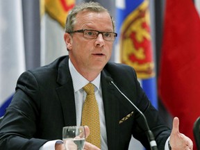 Saskatchewan's Premier Brad Wall says that over the next month, the province will apologize for decades-old policies that saw aboriginal adoptees taken from their homes. REUTERS/Mathieu Belanger