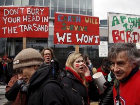 People protest against climate change during a demonstration in Quebec City April 11, 2015. REUTERS/Mathieu Belanger