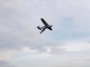 A damaged float plane flies in for a dramatic landing in Fort McMurray, Alta., after it collided with another Cessna 172 in mid-air 21 miles northeast of the airport, about 8p.m. Sunday June 21, 2015. The HERO 1 Medical Helicopter searched and located the other plane in an isolated area. Police confirmed two people were found dead at the crash site. Screen shots courtesy of YouTube channel video NARDOCREW