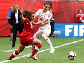 Allysha Chapman (left) is one of five Canadian players with yellow cards entering their quarterfinal matchup against England on Saturday. (Carmine Marinelli/Postmedia Network)