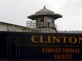 A guard stands in a tower at the Clinton Correctional Facility in Dannemora, New York, in this file photo taken June 8, 2015. Clinton Correctional Facility officer Gene Palmer, 57,  was arrested on Wednesday for the escape of two convicted murderers who have eluded a massive police manhunt for almost three weeks, police said.  REUTERS/Chris Wattie/Files
