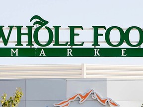 The sign for the Whole Foods grocery store is seen in this Sept. 11, 2007 file photo. REUTERS/Rick Wilking/Files