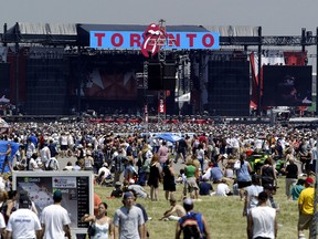 Concert goers fill the area infront of the stage at DownsView Park at the begining of SARSSTOCK Wednesday, July 30, 2003. (Postmedia file photo)