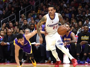 Matt Barnes of the Los Angeles Clippers dribbles away from Jeremy Lin of the Los Angeles Lakers at Staples Center on April 7, 2015 in Los Angeles. (Harry How/Getty Images/AFP)