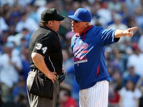 Chicago Cubs manager Joe Maddon argues after being ejected by umpire Sam Holbrook (34) during MLB play against the San Diego Padres at Wrigley Field. (Jerry Lai/USA TODAY Sports)