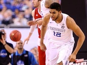 Karl-Anthony Towns of the Kentucky Wildcats reacts after a play in the second half against the Wisconsin Badgers during the NCAA Men's Final Four Semifinal at Lucas Oil Stadium on April 4, 2015. (Streeter Lecka/Getty Images/AFP)