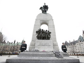 Soldiers stand guard at the National War Memorial in Ottawa, April 9, 2015. REUTERS/Patrick Doyle