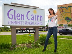 Sylvia Nagy of London, a social work student at Kings University College, shows off a painting of a map of Glen Cairn Thursday. Nagy won an $1,000 Awesome London grant for her community building plan. Mike Hensen/The London Free Press