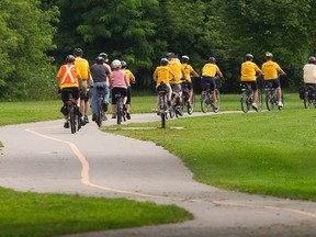 Over 20 yellow-clad cyclists were out in force along the multi-use paths from Hamilton Rd. in the south east to Ross Park in Broughdale near the Richmond St. bridge in London. Mike Hensen/The London Free Press/QMI Agency
