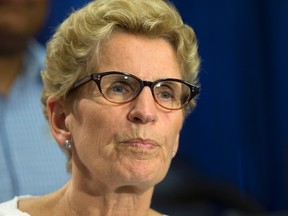 Premier Kathleen Wynne addresses questions about a controversial documentary at an event to promote the upcoming Pan Am Games on June 25, 2015. (Craig Robertson/Toronto Sun)