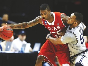 Delon Wright of the Utah Utes drives against Jabril Trawick of the Georgetown Hoyas during the NCAA Tournament this past spring.
The 6-foot-5 guard, was the Raps’ first-round pick Thursday night. (AFP)
