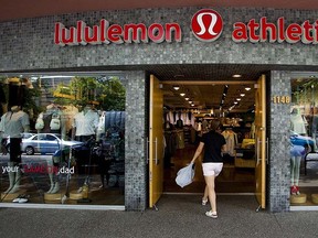 A woman walks into a store of yogawear retailer Lululemon Athletica in downtown Vancouver in this June 11, 2014 file photo. REUTERS/Ben Nelms/Files