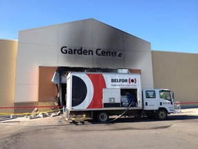 Cleanup after a fatal Edmonton crash at a Walmart in South Edmonton Common. (Ian Kucerak/Edmonton Sun)