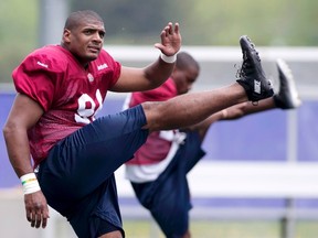 Michael Sam stretches during the Montreal Alouettes rookie training camp in Sherbrooke, in this file photo taken May 27, 2015. (REUTERS/Christinne Muschi/Files)