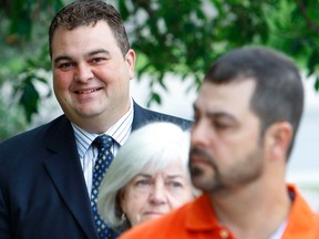 Former MP Dean Del Mastro arrives with his family at a Peterborough, Ont., courthouse for sentencing on June 25, 2015. (Clifford Skarstedt/Peterborough Examiner/Postmedia Network)