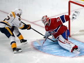 Montreal Canadiens goalie Carey Price (31) stops a shot by Nashville Predators forward Mike Fisher (12) during NHL play at the Bell Centre. (Eric Bolte/USA TODAY Sports)