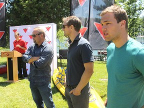 As TSN announcer Gord Miller addresses the crowd at a ceremony at CFB Kingston, Ont. on Fri., June 26, 2015 to acknowledge a $300,000 donation in sports equipment from the Canadian Tire Corporation, sports celebrities Wendel Clark, Jay McClement and Taylor Hall listen. Michael Lea/The Whig-Standard/Postmedia Network