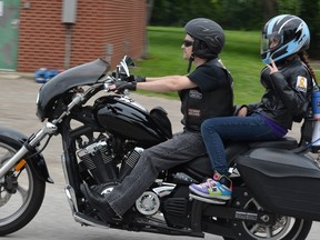 Bob Thomas rides with his daughter Victoria in this 2013 photo from the Ride for Our Cancer Kids (R.O.C.K.) event in Sarnia. This year marks the memorial fundraiser's 12th, raising money for Childhood Cancer Canada. (Handout)