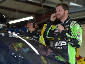 Dale Earnhardt Jr. stands in the garage area during practice for the NASCAR Sprint Cup Series Quicken Loans 400 at Michigan International Speedway on June 12, 2015 in Brooklyn, Mich. (Drew Hallowell/Getty Images/AFP)