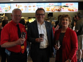 Ron Sutherland, local McDonald's franchise owner, operator, John Betts, CEO of McDonald's Canada and Karen Sutherland at the Division Street McDonald's Friday, June 26. Jacob Rosen/For The Whig-Standard