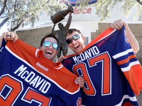 Graham Kilfoyl (l) and Mike Stone shows off their new $250 McDavid Jerseys at the Edmonton Oiler Draft Party at Rexall Place in Edmonton, Alberta Friday, June 26, 2015.Perry Mah/Edmonton Sun/Postmedia Network