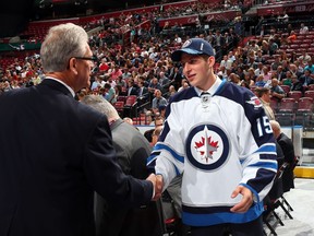 Jansen Harkins reacts after being selected 47th overall by of the Winnipeg Jets during the 2015 NHL Draft at BB&T Center on June 27, 2015 in Sunrise, Florida.  (Bruce Bennett/Getty Images/AFP)