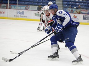 Sudbury Wolves forward Matt Schmalz (27) makes a drive for the net as the Niagara IceDogs' Aaron Haydon chases him down during OHL action in Sudbury this past season. Gino Donato/Sudbury Star/Postmedia Network