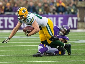 Vikings cornerback Josh Robinson (right), seen here tackling Packers wide receiver Jordy Nelson, apologized for a series of tweets criticizing the legalization of gay marriage across all 50 U.S. states. (Brace Hemmelgarn/USA TODAY Sports)