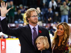 Chris Pronger waves to the Peterborough, Ont., crowd with his wife Lauren Pronger and children during a banner-raising ceremony on Nov. 2, 2014. (Clifford Skarstedt/Postmedia Network)