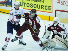 Peterborough Petes' Cameron Lizotte battles with Oshawa Generals' Michael McCarron in front of goalie Matthew Mancina during OHL this past season. Clifford Skarstedt/Peterborough Examiner/Postmedia Network