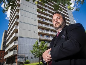Michael Thiele is an Ottawa lawyer who has, in the past, defended clients against evictions from Ottawa Community Housing properties. Thiele is shown in front of an OCH property at 415 MacLaren Street on Friday June 26, 2015. 
Errol McGihon/Ottawa Sun