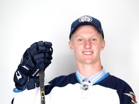 17th overall pick Kyle Connor of the Winnipeg Jets poses for a portrait during the 2015 NHL Draft at BB&T Center on June 26, 2015 in Sunrise, Florida. (Mike Ehrmann/Getty Images/AFP)