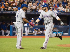 Texas Rangers first baseman Mitch Moreland, right, celebrates with Texas Rangers shortstop Elvis Andrus runs the  after hitting a home run during the fourth inning in a game against the Toronto Blue Jays at Rogers Centre. (Nick Turchiaro-USA TODAY Sports)