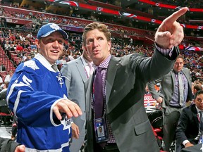 Maple Leafs head coach Mike Babcock chats with Travis Dermott after the defenceman was made the team’s second-round pick yesterday at the NHL draft in Sunrise, Fla. (AFP)