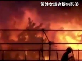 Silhouettes of people running from a blaze are seen at the Formosa Fun Coast water park, on the outskirts of the capital, Taipei in this still image taken from video shot on June 27, 2015 and provided by Apple Daily Taiwan. REUTERS/Ms. Huang/Apple Daily Taiwan